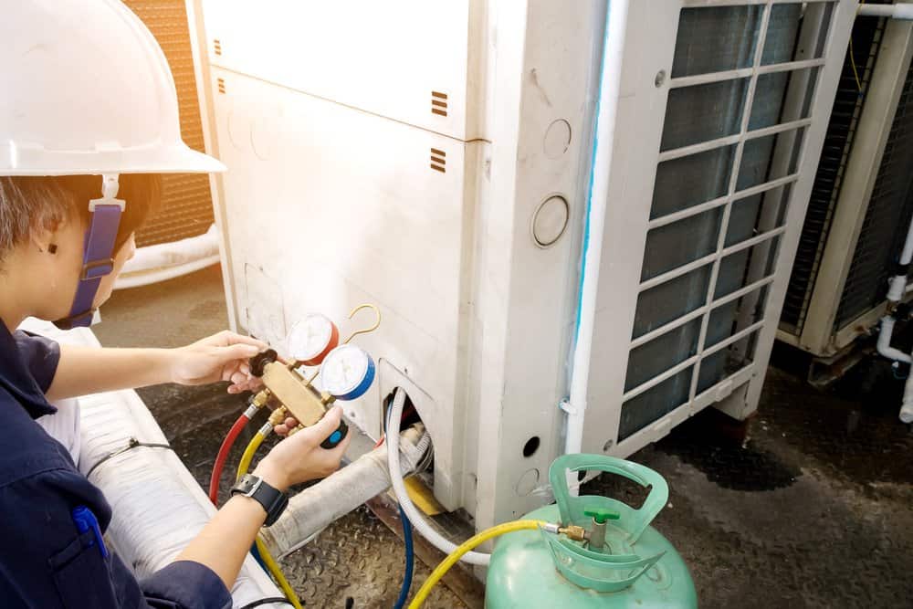 man performing preventative hvac maintenance